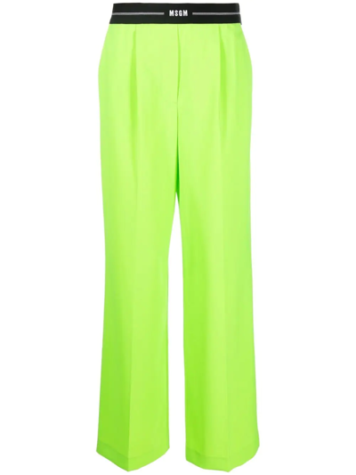 Shop Msgm Logo-waist Wide-leg Trousers In Green