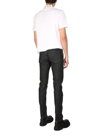 Shop Versace Slim Fit Jeans In Nero
