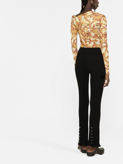 Shop Paco Rabanne Knitted Flared Trousers In Black
