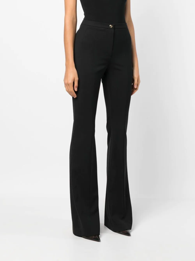 Patou Pleated Wool-blend Twill Flared Pants In Black