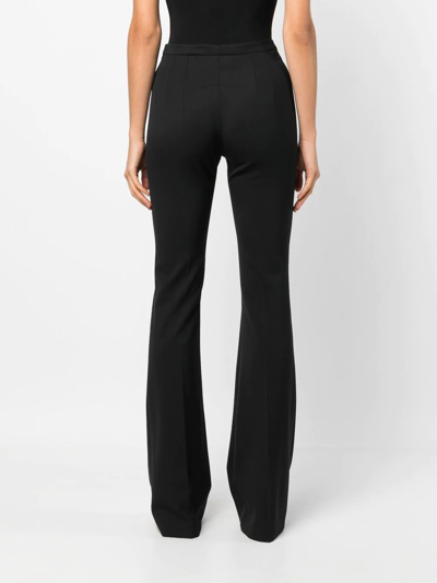 Shop Patou Mid-rise Flared Trousers In Black