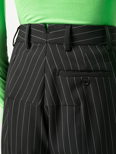 Shop Vetements Pinstripe Flared Trousers In Black
