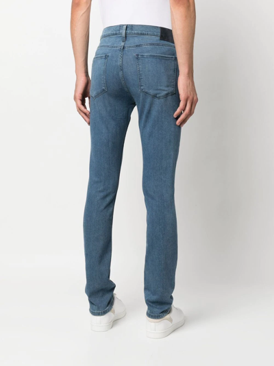 Shop Paige Mid-rise Slim-fit Jeans In Blue