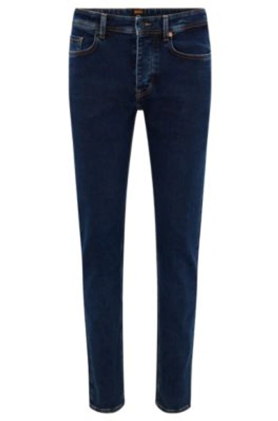 Hugo Boss Tapered-fit Jeans In Blue-black Knitted Denim In Dark Blue |  ModeSens