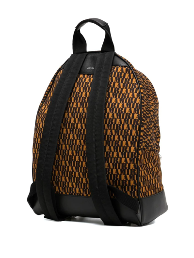 Shop Amiri Monogram-print Backpack In Yellow