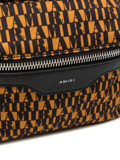 Shop Amiri Monogram-print Backpack In Yellow