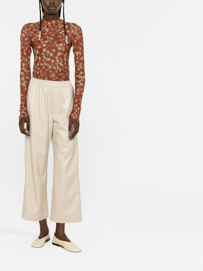 Shop Nanushka Faux-leather Cropped Trousers In Neutrals