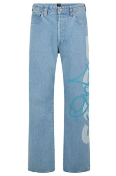 Shop Hugo Boss Relaxed-fit Jeans With Graffiti Logos In Light Blue