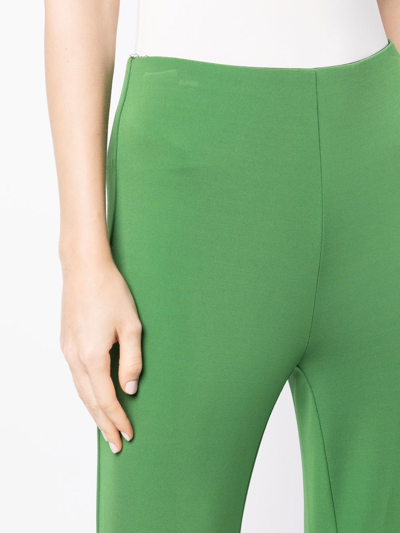 Shop Tibi Mid-rise Flared-leg Trousers In Green