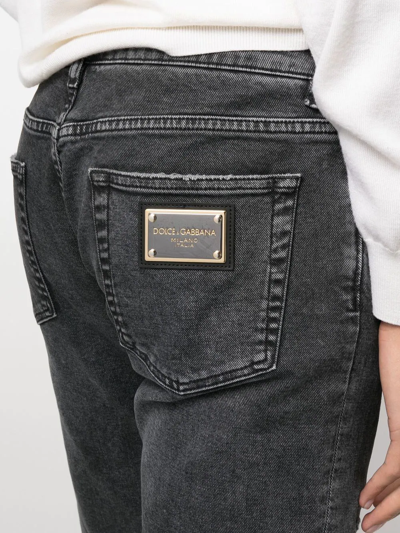 Shop Dolce & Gabbana Logo-plaque Distressed Jeans In Schwarz