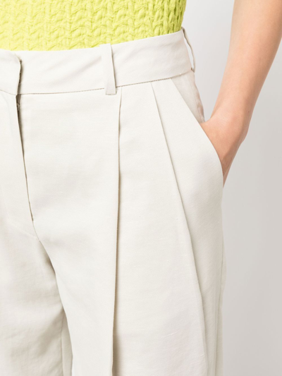 Shop Low Classic Wide-leg Pleat-detail Trousers In Neutrals