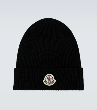 Shop Moncler Knitted Wool Beanie In Black