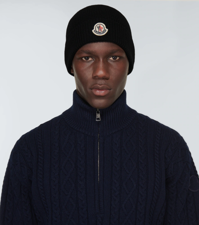 Shop Moncler Knitted Wool Beanie In Black
