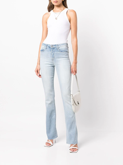 Shop L Agence Ruth Raw-cut Flared Jeans In Blau