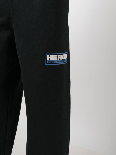 Shop Heron Preston Logo-patch Wide-leg Track Pants In Schwarz