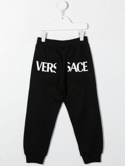 Shop Versace Greca Print Track Pants In Black