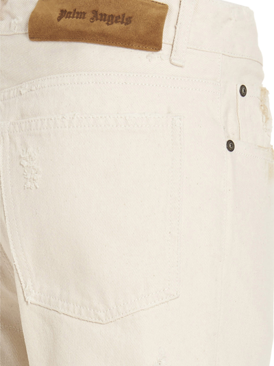 Shop Palm Angels Patches Jeans In White