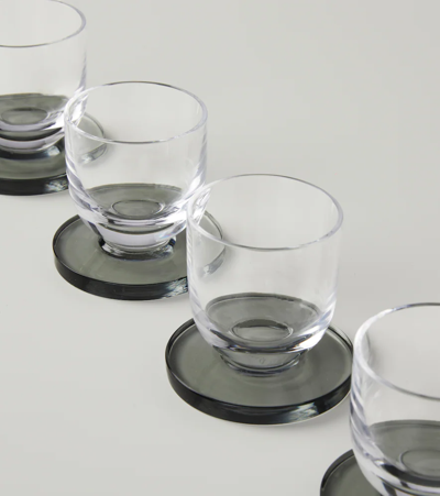 Shop Tom Dixon Puck Set Of 4 Shot Glasses In Tra