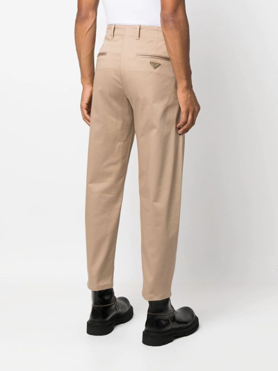 Shop Prada Logo-plaque Tailored Trousers In Nude