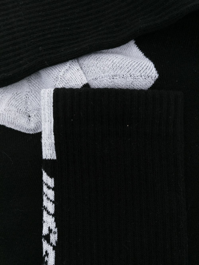 Shop Msgm Contrasting Logo-print Socks In Black