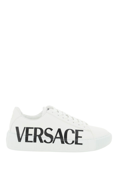Shop Versace Logoed Greca Sneakers In White