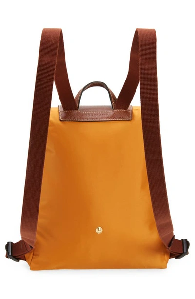 Shop Longchamp Le Pliage Backpack In Saffron