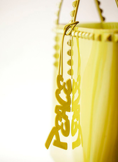 Shop Carmen Sol Peace Charm In Yellow