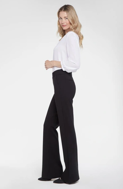 Shop Nydj Pull-on Flare Leg Ponte Knit Trousers In Black