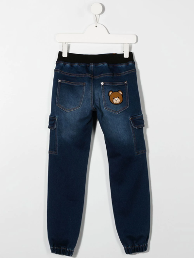 Shop Moschino Teddy Cargo-pocket Jeans In Blue