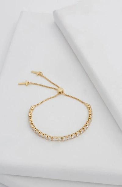 Shop Ted Baker Melrah Icon Crystal Slider Tennis Bracelet In Gold Tone Clear Crystal