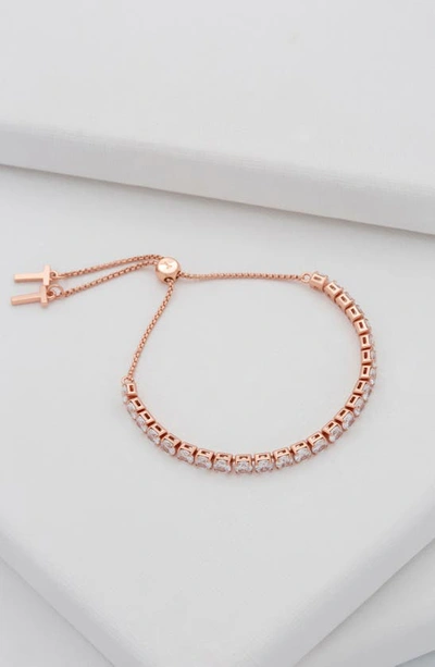 Shop Ted Baker Melrah Icon Crystal Slider Tennis Bracelet In Rose Gold Tone Clear Crystal