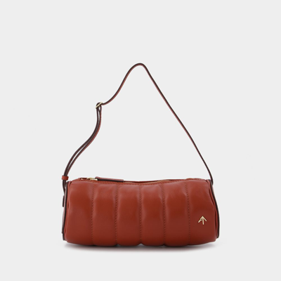 Shop Manu Atelier Padded Cylinder Bag In Red