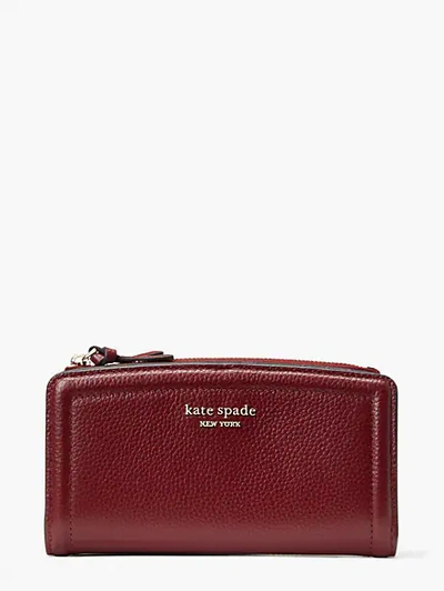 Shop Kate Spade Knott Zip Slim Wallet In Autumnal Red