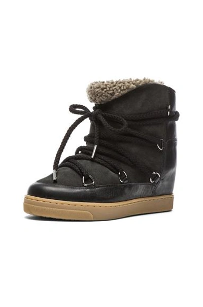 Shop Isabel Marant Nowles Shearling And Leather Boots In Black