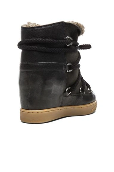 Shop Isabel Marant Nowles Shearling And Leather Boots In Black