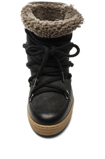 Shop Isabel Marant Nowles Shearling And Leather Boots In Black