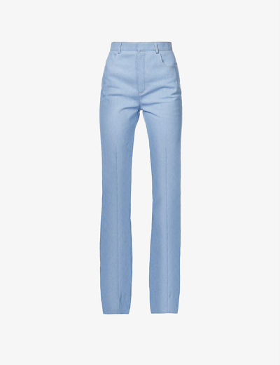 Shop Saint Laurent Women's Bleu Ciel Contrast-stitch Pressed-crease Flared-leg High-rise Cotton Trousers