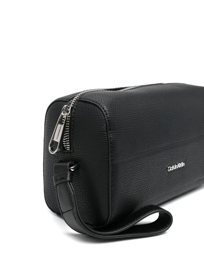 Shop Calvin Klein Embossed-logo Detail Wash Bag In Black