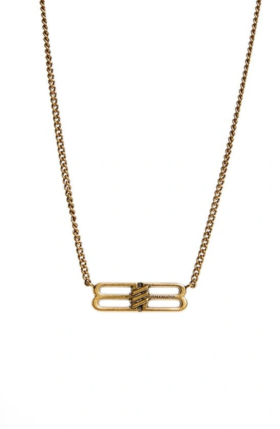 Shop Balenciaga Bb Icon Pendant Necklace In Antique Gold