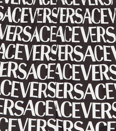 Shop Versace Logo Swim Trunks In Nero+bianco