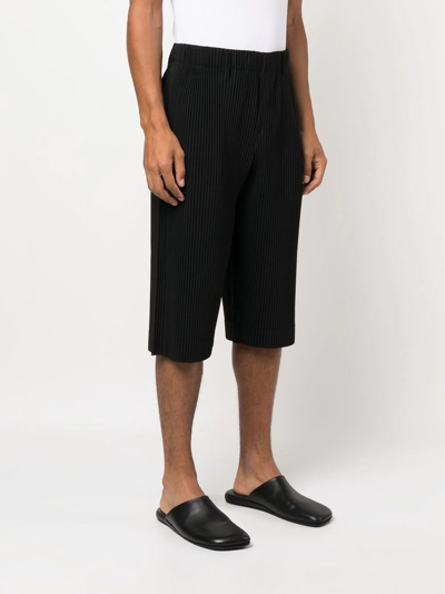 Shop Issey Miyake Pleated Cropped Trousers In Black