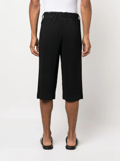 Shop Issey Miyake Pleated Cropped Trousers In Black