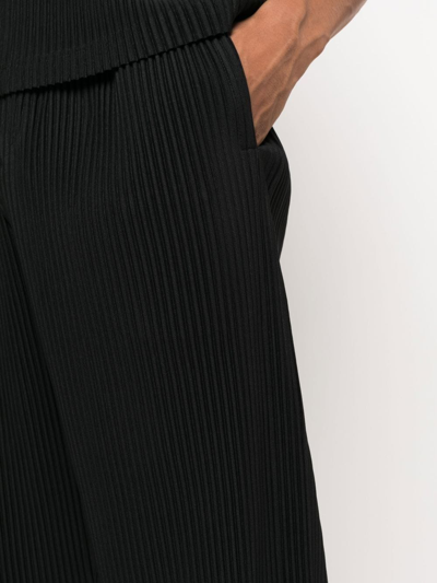 Shop Issey Miyake Pleated Cropped Trousers In Black