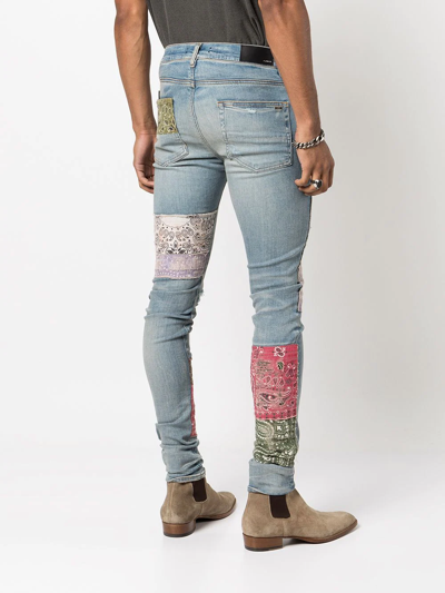 Shop Amiri Distressed Patchwork Skinny Jeans In 408 Clay Indigo