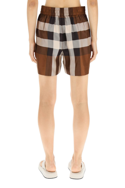 Shop Burberry Exploded Check Silk Shorts In Brown