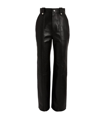 Shop Nanushka Leather Zelda Trousers In Black