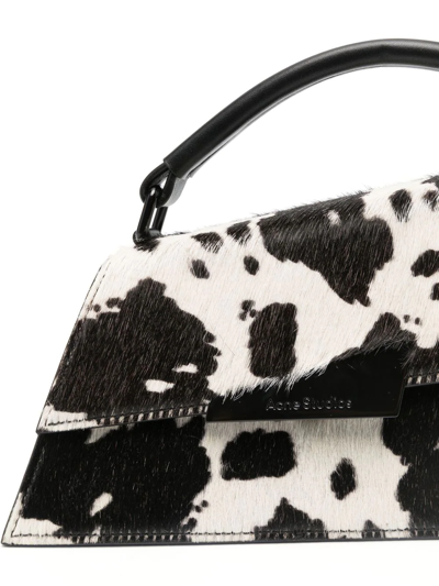Shop Acne Studios Distortion Cow-print Mini Bag In White