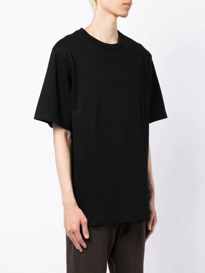 Shop Juunj Graphic-print Cotton T-shirt In Black