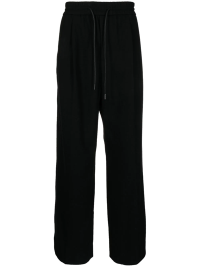 Shop Juunj Wide-leg Elasticated-waist Trousers In Black