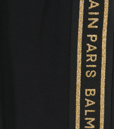 Shop Balmain Glitter-logo Cotton Jersey Sweatpants In Nero/oro